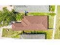 Overhead view of a single-story home highlighting the roof and landscaping at 2344 28Th E Ave, Palmetto, FL 34221