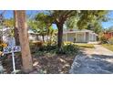 Charming home showcasing established landscaping, mature trees, and a well-maintained exterior at 2448 45Th S St, St Petersburg, FL 33711