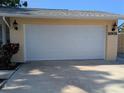 Attached two car garage offers secure parking and convenience with easy access to the home's interior at 2802 Jamaica St, Sarasota, FL 34231