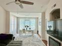 Bright living room showcasing an open floor plan and connecting to the dining area at 4122 Central Sarasota Pkwy # 1923, Sarasota, FL 34238