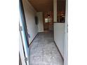 Inviting entryway with unique ceiling leads to a kitchen with natural light at 4700 Neptune Rd, Venice, FL 34293