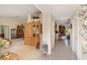 Bright hallway with neutral walls offering smooth transition to other rooms at 5955 Ferendina St, North Port, FL 34291