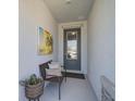 Inviting entryway with a welcome chair, stylish decor, and bright natural light at 11713 Chevelon Ln, Parrish, FL 34219