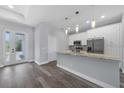 Bright kitchen with a center island, sleek countertops, and ample cabinet space at 12534 Mohican Ave, Port Charlotte, FL 33953