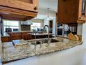 A gourmet kitchen that features granite countertops and top-of-the-line stainless steel appliances at 173 Bath Club N Blvd, North Redington Beach, FL 33708