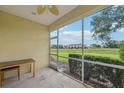 Covered screened patio offering pleasant outdoor space with views of the lush surroundings at 2353 Rosewood Ln, North Port, FL 34289