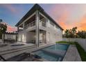 Stunning two-story home with a private pool, covered patio, and balcony for outdoor relaxation at 2596 Floyd St, Sarasota, FL 34239