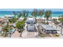 Modern three-story home boasting beach access at 2918 Avenue E, Holmes Beach, FL 34217