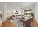 Bright and airy living room with stylish furniture and a view of the pool area at 4180 Via Mirada, Sarasota, FL 34238