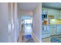 Inviting entryway with tile floors leading to an open living area with lots of natural light at 4800 Gulf Of Mexico Dr # 204, Longboat Key, FL 34228