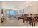 Inviting living room featuring water views, comfortable seating, and a dining area at 4800 Gulf Of Mexico Dr # 204, Longboat Key, FL 34228