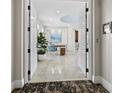 Bright entryway with marble floors, white doors, and modern decor at 50 Central Ave # 17Phd, Sarasota, FL 34236