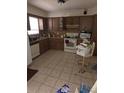 Functional kitchen featuring a white stove and ample counter space at 519 36Th E Ave, Bradenton, FL 34208