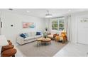 Contemporary living room featuring modern furnishings, a neutral color palette, and bright natural light at 578-580 Companion Way, Longboat Key, FL 34228