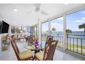 Open dining area with seating for four and beautiful ocean views through large windows at 6470 Mourning Dove Dr # 201, Bradenton, FL 34210