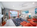 Cozy living room with stylish decor, plush seating and views of the water at 6470 Mourning Dove Dr # 201, Bradenton, FL 34210