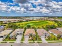 Stunning aerial view of home in a lakeside community, showcasing its prime location and neighborhood at 749 Tailwind Pl, Sarasota, FL 34240