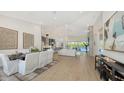 Open-concept living space featuring stylish furniture and bright, natural light at 8001 20Th W Pl, Bradenton, FL 34209