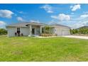 Charming single Gathering home featuring a well manicured lawn and a two car garage at 9601 Calumet Blvd, Port Charlotte, FL 33981
