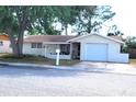 Well-maintained single-Gathering home featuring an attached garage at 9835 El Camino Real Ave, Port Richey, FL 34668