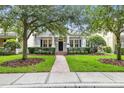 Charming one story home with a well-manicured lawn and inviting brick pathway at 11504 Splendid Ln, Tampa, FL 33626