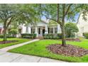 Charming one story home with a well-manicured lawn and inviting brick pathway at 11504 Splendid Ln, Tampa, FL 33626