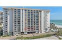 High-rise condo building with multiple balconies, near ocean views and convenient parking at 1212 Benjamin Franklin Dr # 306, Sarasota, FL 34236