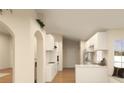 Bright and airy kitchen with white cabinets, modern appliances, and an open layout perfect for entertaining at 12541 Estrella Blvd, Punta Gorda, FL 33955