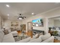 Cozy living room with a large sectional sofa, hardwood floors, and modern decor at 1814 6Th W Ave, Bradenton, FL 34205