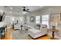 Bright living room featuring a comfortable sectional sofa, hardwood floors, and natural light at 1814 6Th W Ave, Bradenton, FL 34205