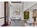 Bright lobby featuring stylish seating and an eye-catching living moss wall at 300 S Pineapple Ave # 302, Sarasota, FL 34236