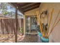 Charming front porch with decorative plants, mosaic tile, and courtyard access at 3955 Glen Oaks Manor Dr, Sarasota, FL 34232