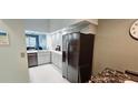 Bright modern kitchen with stainless steel appliances and light gray cabinets at 4415 45Th W Ave # 203, Bradenton, FL 34210