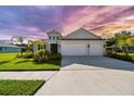 Charming single Gathering home with a wide driveway, two-car garage, and lovely lawn at 4515 Roycroft Ter, Parrish, FL 34219
