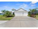 Inviting single-Gathering home with a spacious driveway, two-car garage, and vibrant landscaping at 4515 Roycroft Ter, Parrish, FL 34219