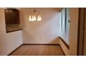 Cozy dining room filled with natural light from the window and a modern light fixture at 4941 25Th W St # 101, Bradenton, FL 34207