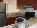 Functional kitchen featuring stainless steel appliances, ample counter space, and tiled backsplash at 4941 25Th W St # 101, Bradenton, FL 34207