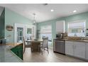Inviting dining area with tile flooring, a round table, and easy access to the kitchen at 5209 Lansdowne Way, Palmetto, FL 34221