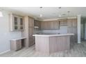 Spacious kitchen features an island with countertop seating, pendant lights, and ample cabinet space at 8226 Sweden Blvd, Punta Gorda, FL 33982