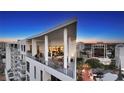 Wide condo balcony showing outdoor seating with views of the city at 111 S Pineapple Ave # 1210, Sarasota, FL 34236