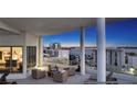 Expansive balcony offering stunning city and bay views with lounge seating and entertainment space at 111 S Pineapple Ave # 1210, Sarasota, FL 34236