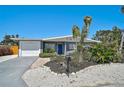 Lovely single-story home with attached garage, updated landscaping, and eye-catching palm trees at 1112 65Th Nw St, Bradenton, FL 34209