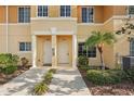Close up of townhome exterior with landscaping and walkway to the front door at 12358 Destiny Dr, Venice, FL 34292