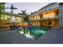 Backyard oasis with a modern pool, water features, and ample space for entertaining at 1365 Harbor Dr, Sarasota, FL 34239