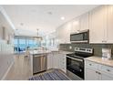 Updated kitchen with stainless steel appliances, granite countertops, and gorgeous ocean views at 1800 Gulf N Dr # 112, Bradenton Beach, FL 34217