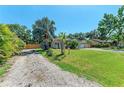 Lovely single-story home with a well-maintained lawn and mature trees at 2303 58Th E St, Palmetto, FL 34221
