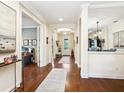 Elegant foyer with hardwood floors, arched doorways, and stylish decor; setting a welcoming tone at 2525 Vaccaro Dr, Sarasota, FL 34231