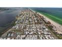 Aerial view of coastal neighborhood, located near a beautiful beach and stunning blue ocean at 2601 Gulf N Dr # 317, Bradenton Beach, FL 34217