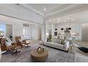Spacious living room features modern furniture and open layout, perfect for entertaining guests at 508 Blue Shell Loop, Sarasota, FL 34240