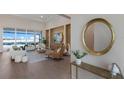 Bright, neutral living room with waterfront views, modern furniture, and neutral tones at 508 Blue Shell Loop, Sarasota, FL 34240